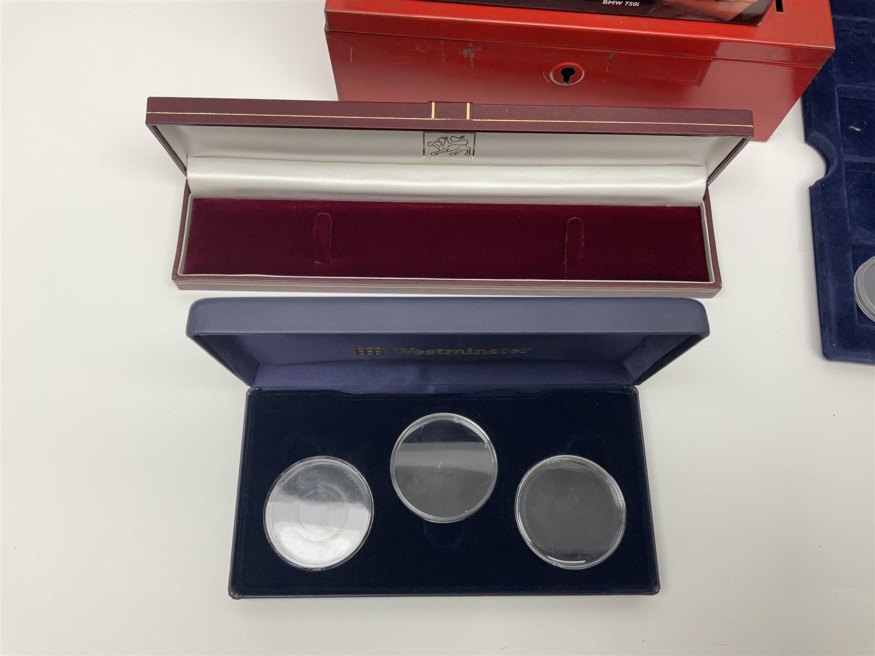 Pierce Brosnan framed picture, James Bond books, Corgi Tomorrow Never Dies BMW 750i model, small number of stamps, empty coin displays and other miscellaneous items