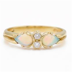 18ct gold opal and diamond four stone ring, two round brilliant cut diamonds, with a singl...
