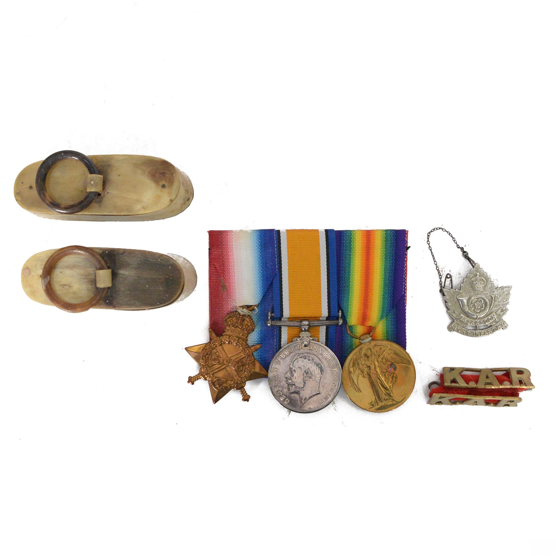 WWI trio medal group, 1914-15 Star, War and Victory medal, awarded to 2631 SJT T.M. Cave. 3- Lond. R, together with two horn snuff boxes
by vendors repute the two snuff boxes were presented to T.M. Cave by his men in the Kings African Rifles at the end of WWI