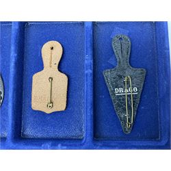 Twelve French military metal badges mounted on leather fobs including Legion, Artillery, Parachutist, Air Force, Infantry etc