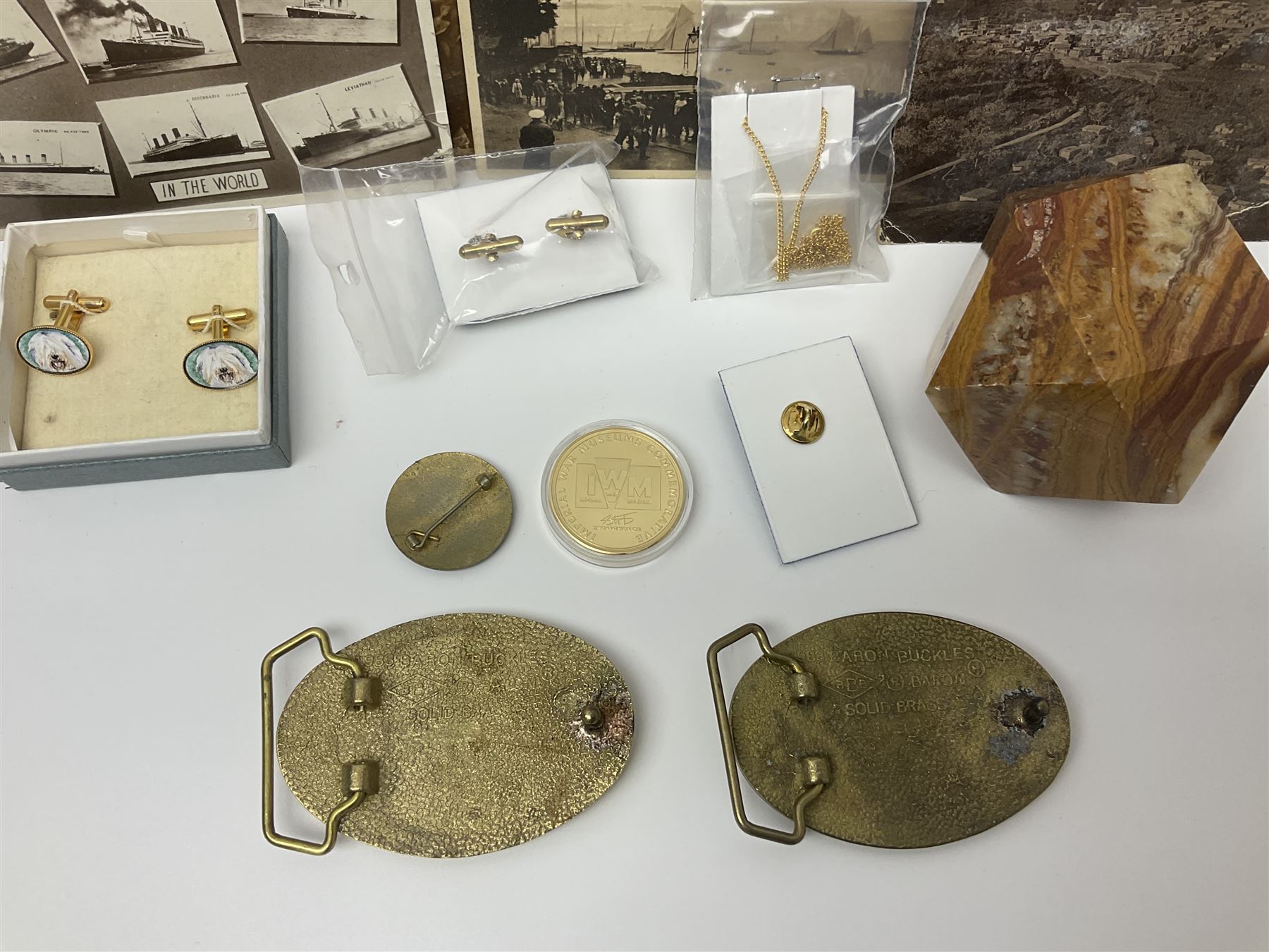 Studio Danielle Old English Sheepdog jewellery including two pairs of cufflinks, necklace and pin, together with similar belt buckle, hardstone tetradecahedron paperweight, postcards and an Imperial War Museum Falklands Conflict coin