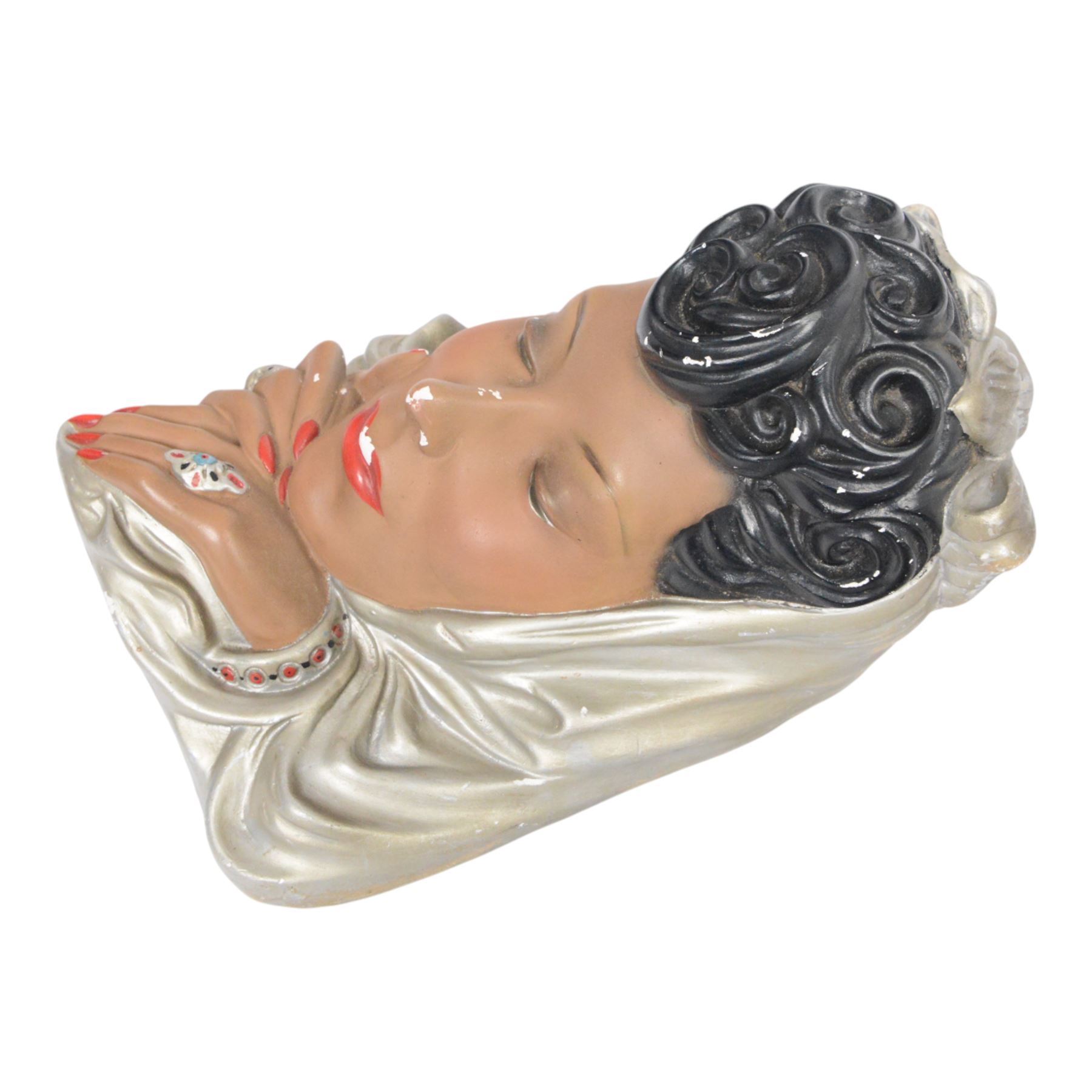 Art Deco style plaster wall mask, depicting a woman in a silver headdress with red lips and nails, H33cm