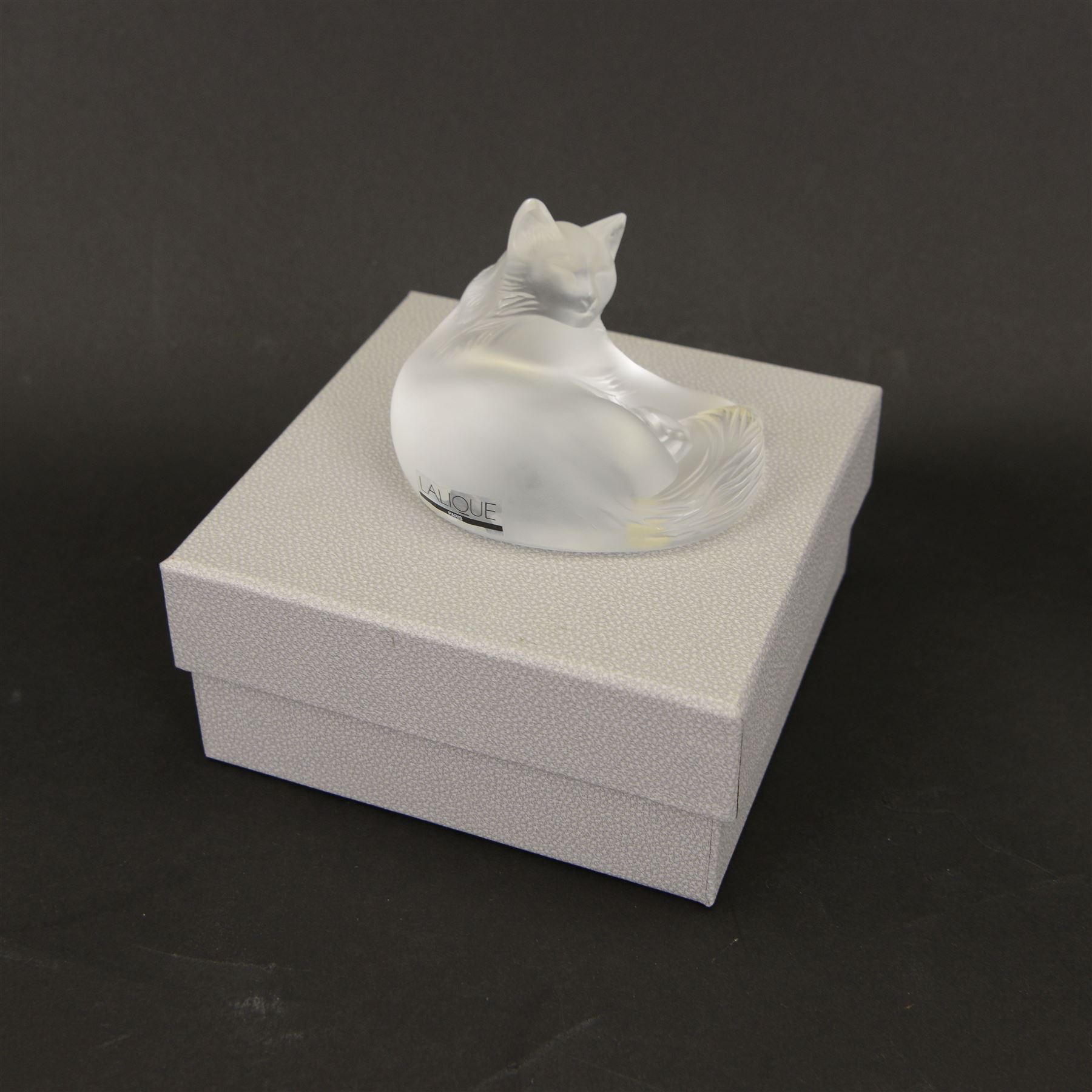 Lalique glass cat in recumbent pose, signed to base, with original box, H3cm