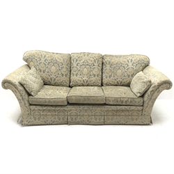 Three seat sofa upholstered in a floral patterned gold and teal fabric, scrolling arms (W240cm) and a matching armchair (W97cm)