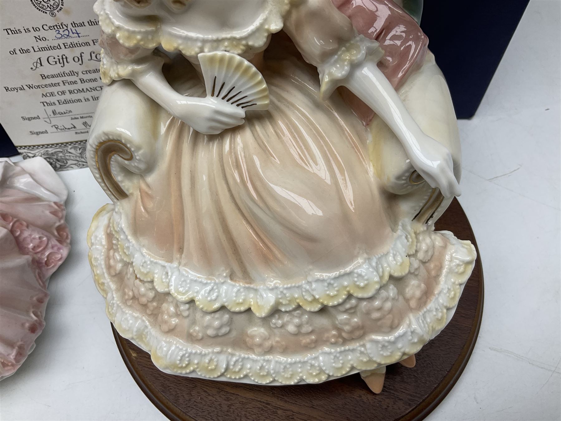 Two Royal Worcester figures, comprising A Gift of Love from the Age of Romance Series, limited edition 325/500, with certificate and original box and Royal Premier from the Glittering Occasions series, with original box 
