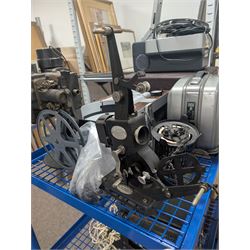 Collection of projectors, including Transpaque Junior overhead projector, Demo Comm 1 overhead projector, Bolex 18-9 Duo, Bolex 18-5, Pathescope Kid, Kodascope Model C, collection of video tapes and film reels, empty projector box, Kinay 816 editor, etc