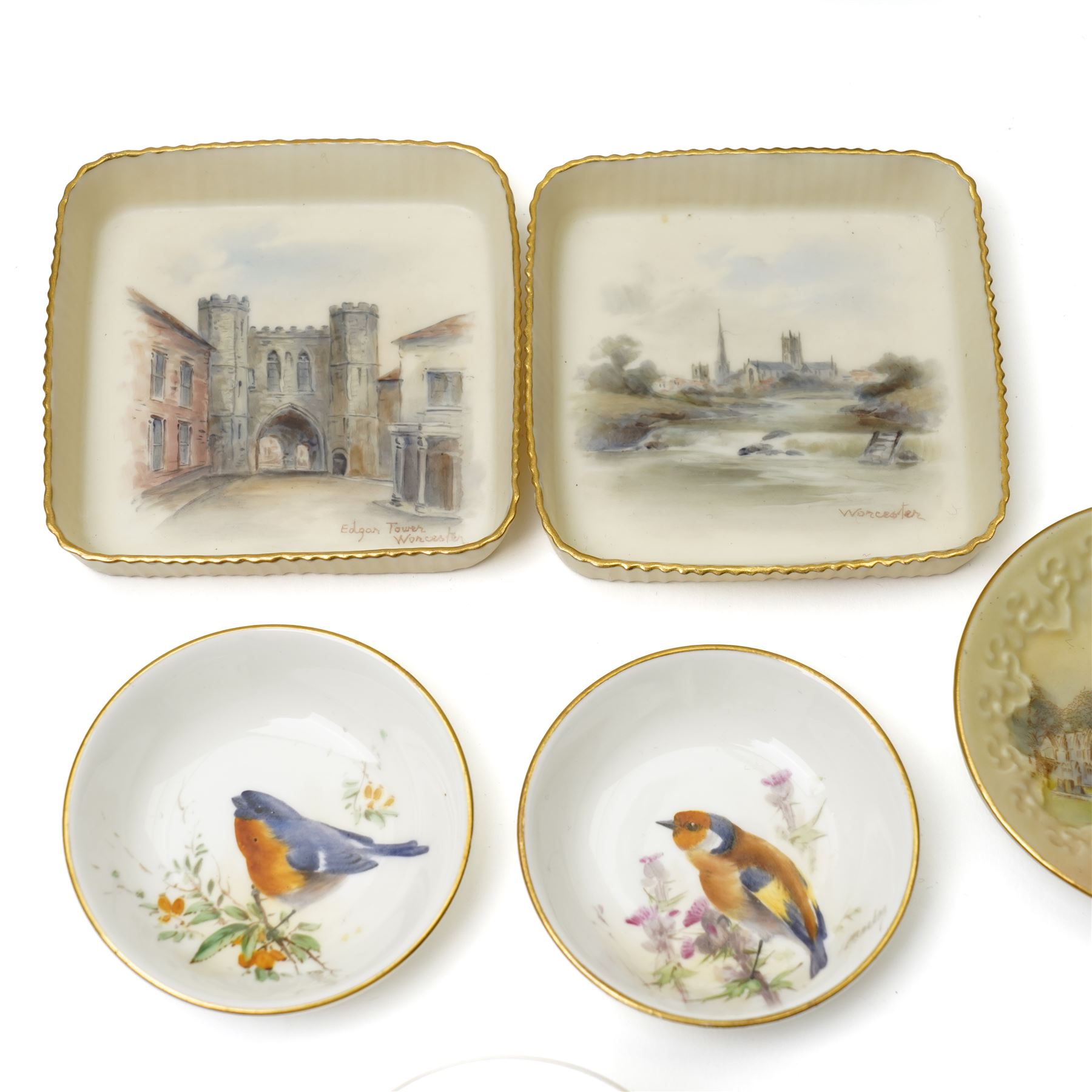 Nine hand-painted Royal Worcester items, comprising two trays painted with Worcester landscapes including 'Edgar Tower', a circular blush ivory tray painted with 'St Mary's Abbey - York', two trays and two covered trinket dishes painted with birds by Ernest Barker and H Powell, miniature jug painted by J Allen, and a Hadley Ware ewer, H11cm (9)