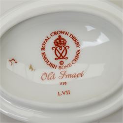 Four Royal Crown Derby Imari 1128 pattern boxes, largest D8.5cm, together with two round trays in the same pattern, D11cm, all boxed (6)