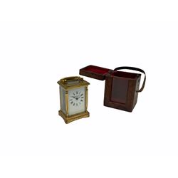 A late 19th century French timepiece Carriage clock complete with original traveling case, eight-day jewelled lever movement with integral winding key, bevelled glass panels to the case and a rectangular glass panel to the top of the case, white enamel dial with roman numerals, minute markers and steel hands, traveling case complete with original viewing glass, sliding cover and carrying handle.