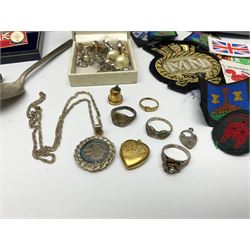 Assorted collectables, to include a quantity of pin badges, blazer badges, buttons, two vintage calculators, WW2 wound badge, three silver rings, and quantity of costume jewellery and watches, Continental bisque figure of a horseman, etc., in one box 
