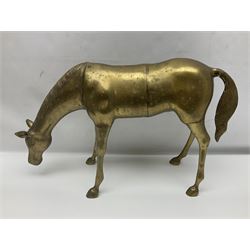 Pair of large brass horse figures, the first modelled as a standing horse, the second as a horse bending to graze, tallest H27cm