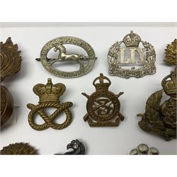 Nineteen Yeomanry metal cap badges including Derbyshire, Northamptonshire, Essex, Glamorgan, Staffordshire, City of London, Surrey, Shropshire, Hertfordshire etc; together with eleven Fusiliers badges including Lancashire, Royal Welch, Northumberland etc (30)