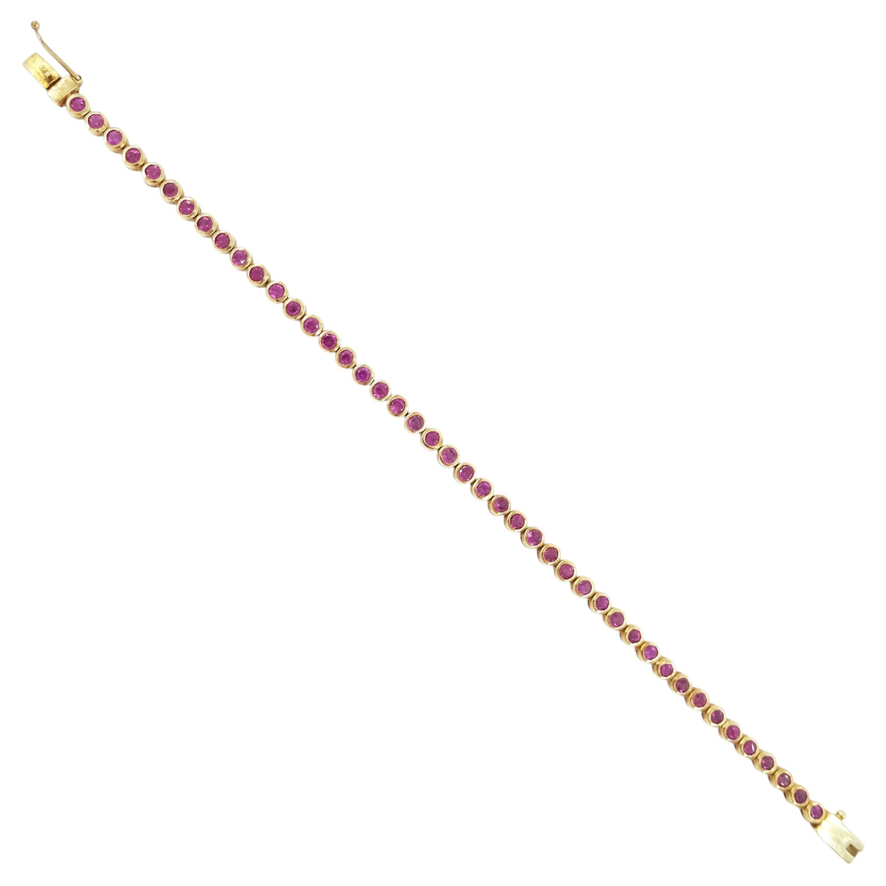 9ct gold garnet bracelet, bezel set with forty-four round cut garnets, hallmarked