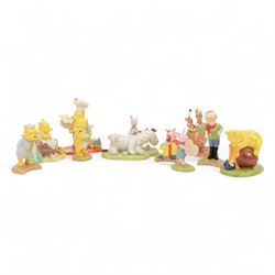 Ten Royal Doulton Winnie the Pooh figures, including First Air Friends, Happy Bear, Oh Bot...