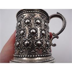 Victorian silver christening mug, with repousse and chased scroll and bead decoration, lozenge shaped cartouche engraved with monogrammed initials and acanthus capped C scroll handle, hallmarked Robert Hennell III, London 1861, H9.3cm