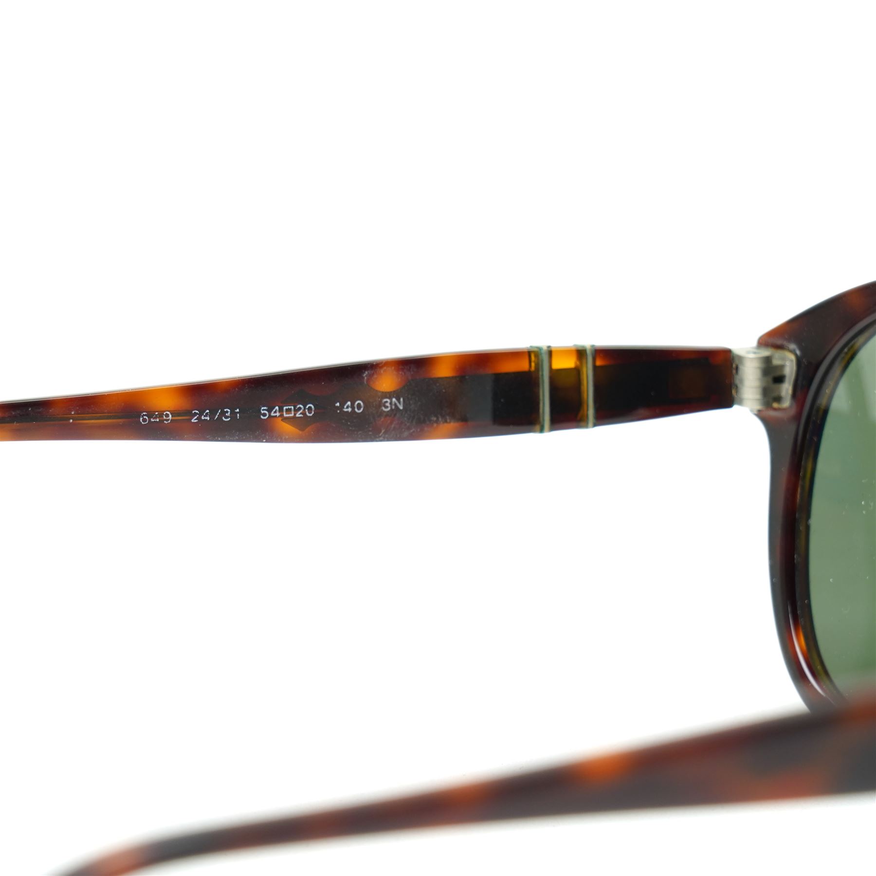 Persol tortoiseshell acetate sunglasses, handmade in Italy, with dark green lenses, signature silver-tone arrow hinges and keyhole bridge, temple interiors stamped Persol and CE marks, together with original Persol leather case
