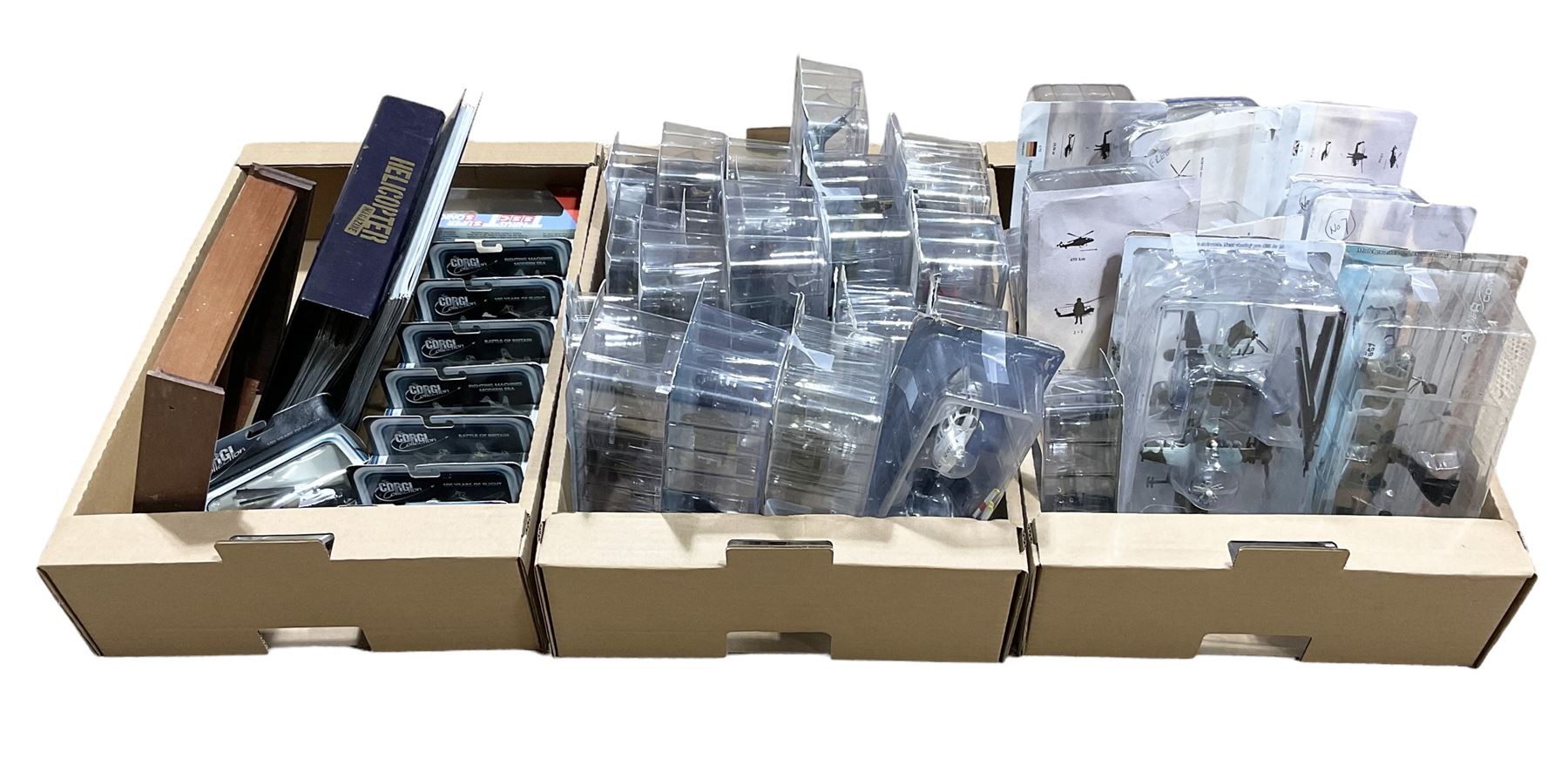 Thirty-six Amer Czechoslovakia periodical issued metal models of helicopters in original packaging; with thirty-nine issues of 'Helicopter Magazine' in two original binders; together with eight Corgi Collection die-cast military models; all boxed; and two others with small display rack; in three boxes