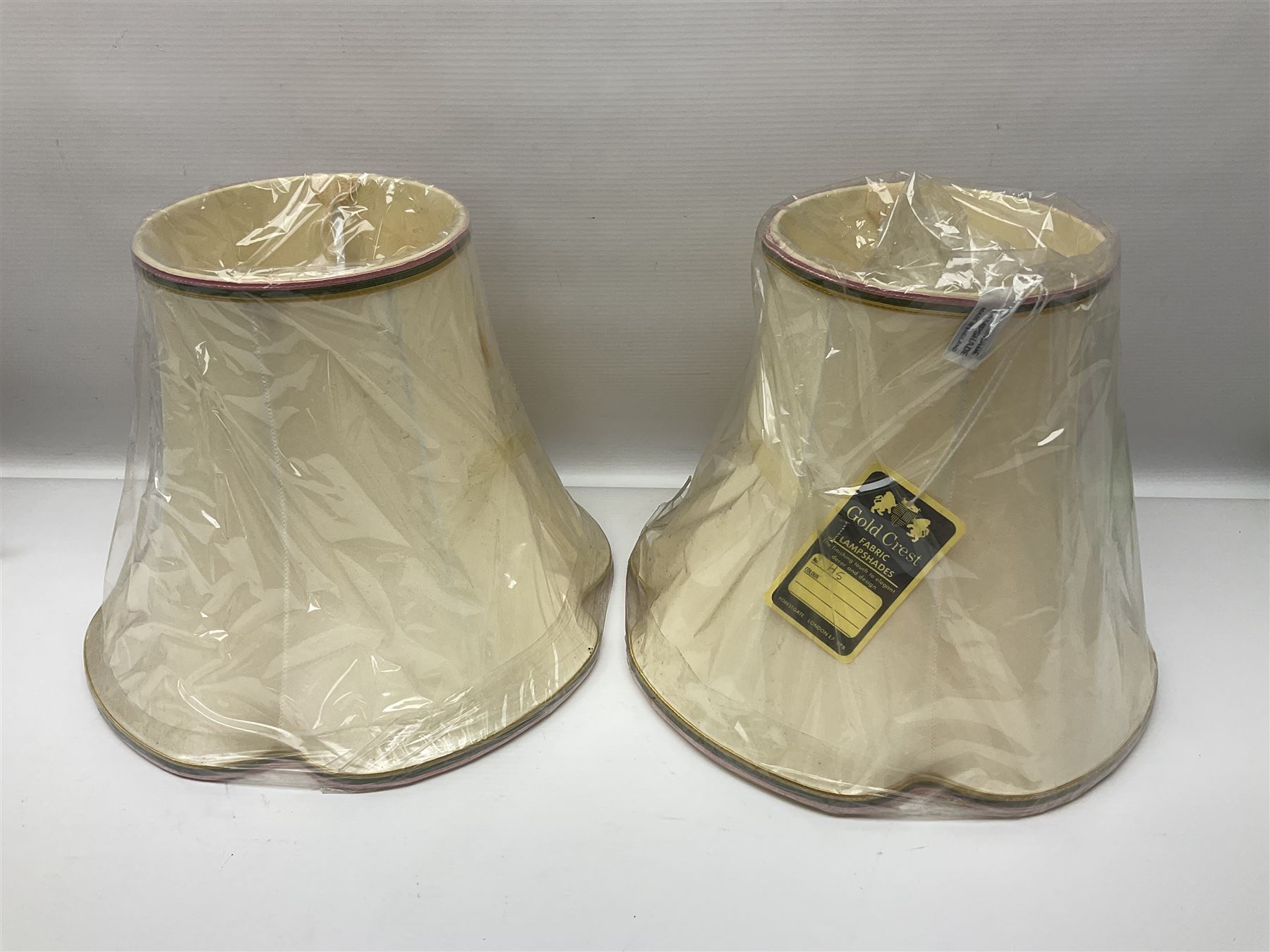 Pair of Moorcroft table lamps of candlestick form in magnolia pattern, with Moorcroft shades, H50cm 
