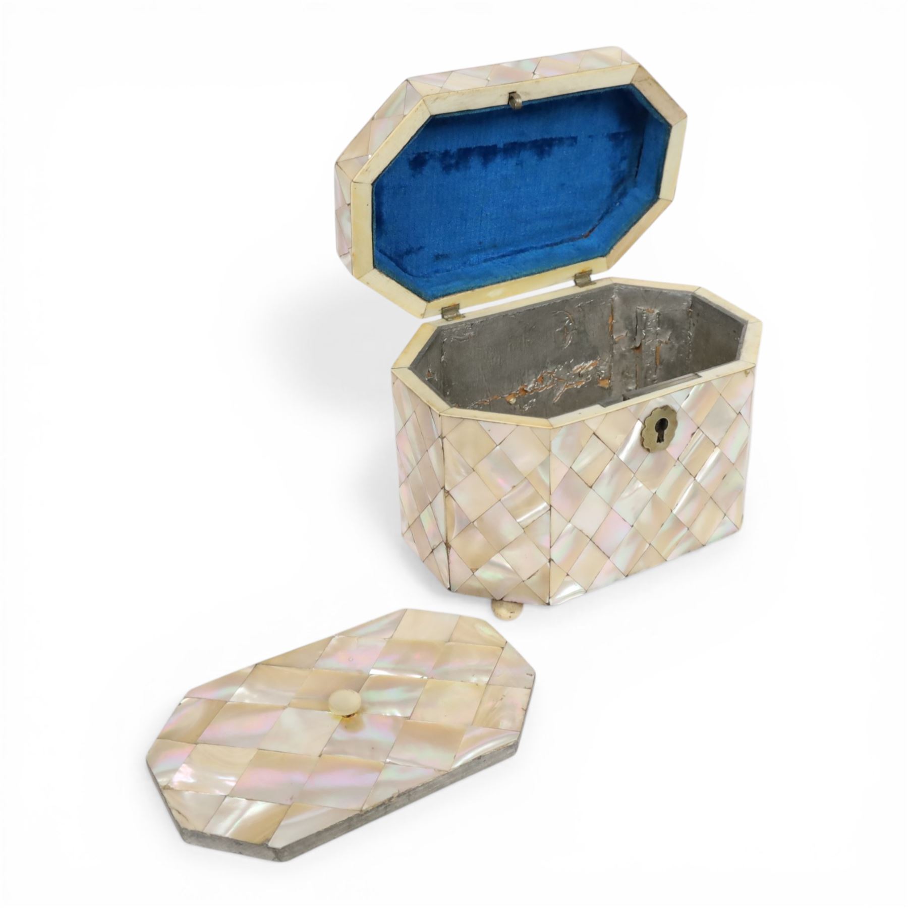 19th century mother of pearl tea caddy, of rectangular form with canted corners, the hinged lid enclosing a single lidded compartment, raised upon bun feet, H11cm D10cm L13cm
This item has been registered for sale under Section 10 of the APHA Ivory Act 