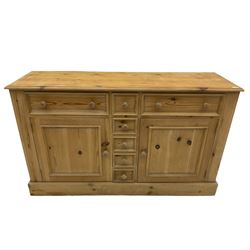 Solid pine dresser, fitted with seven drawers, two cupboards, with plate rack