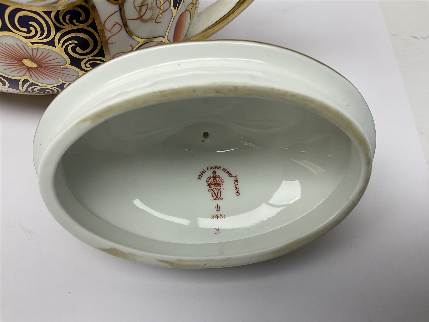 Royal Crown Derby 2451 Imari pattern three piece tea set, comprising teapot, covered sucrier and milk jug, teapot H12cm 