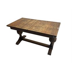 19th century oak extending dining table, rectangular top raised on gadroon carved baluster end supports united by stretcher, on sledge feet