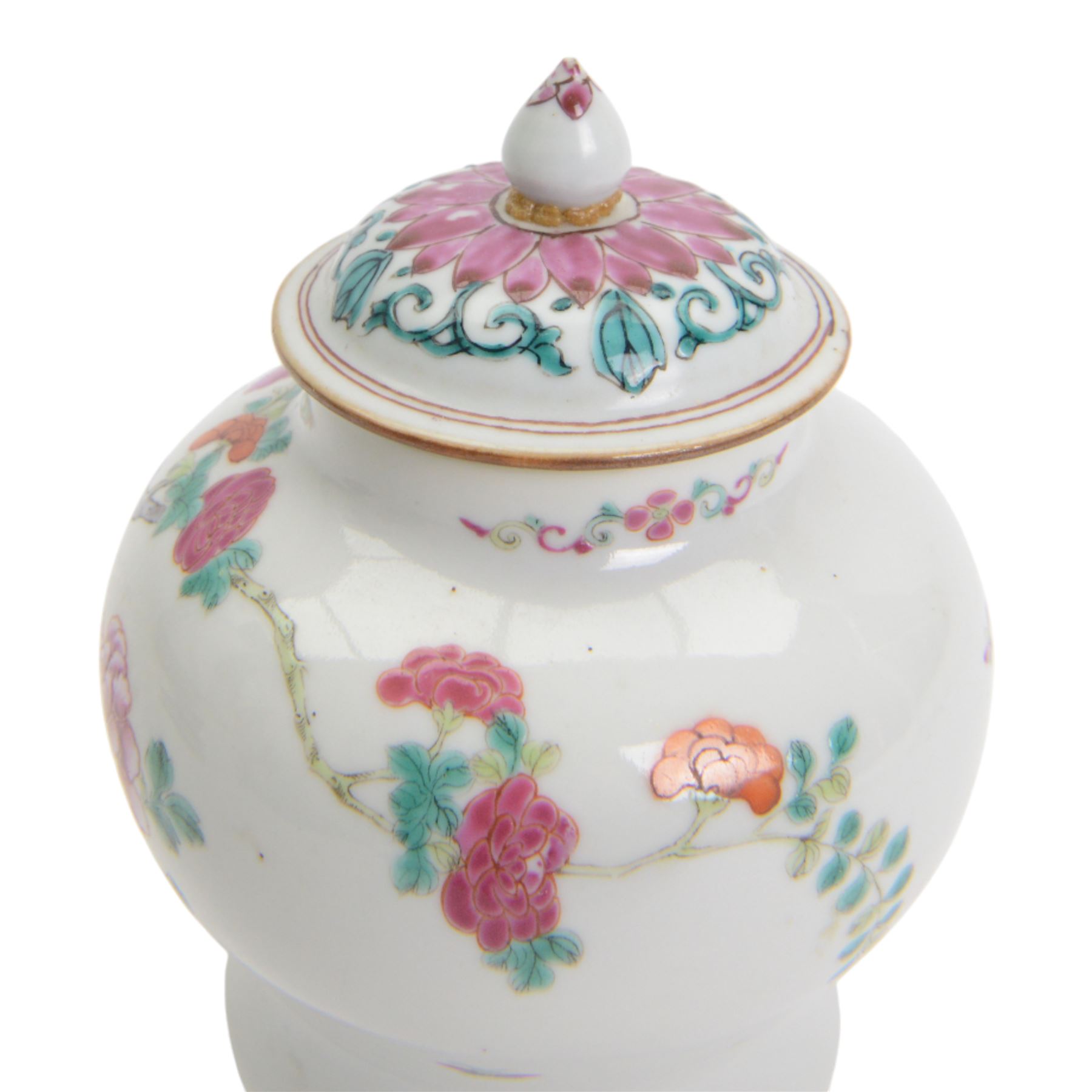 Chinese Qianlong period famille rose porcelain jar and cover, of small squat baluster form with domed cover and knop finial, finely enamelled in the famille rose palette with peony blooms, flowering prunus and bamboo issuing from pierced rockwork, upon a white glazed ground, with underglaze blue double ring mark beneath, H15cm

Provenance: From the collection of Andrew Chichester Everitt.