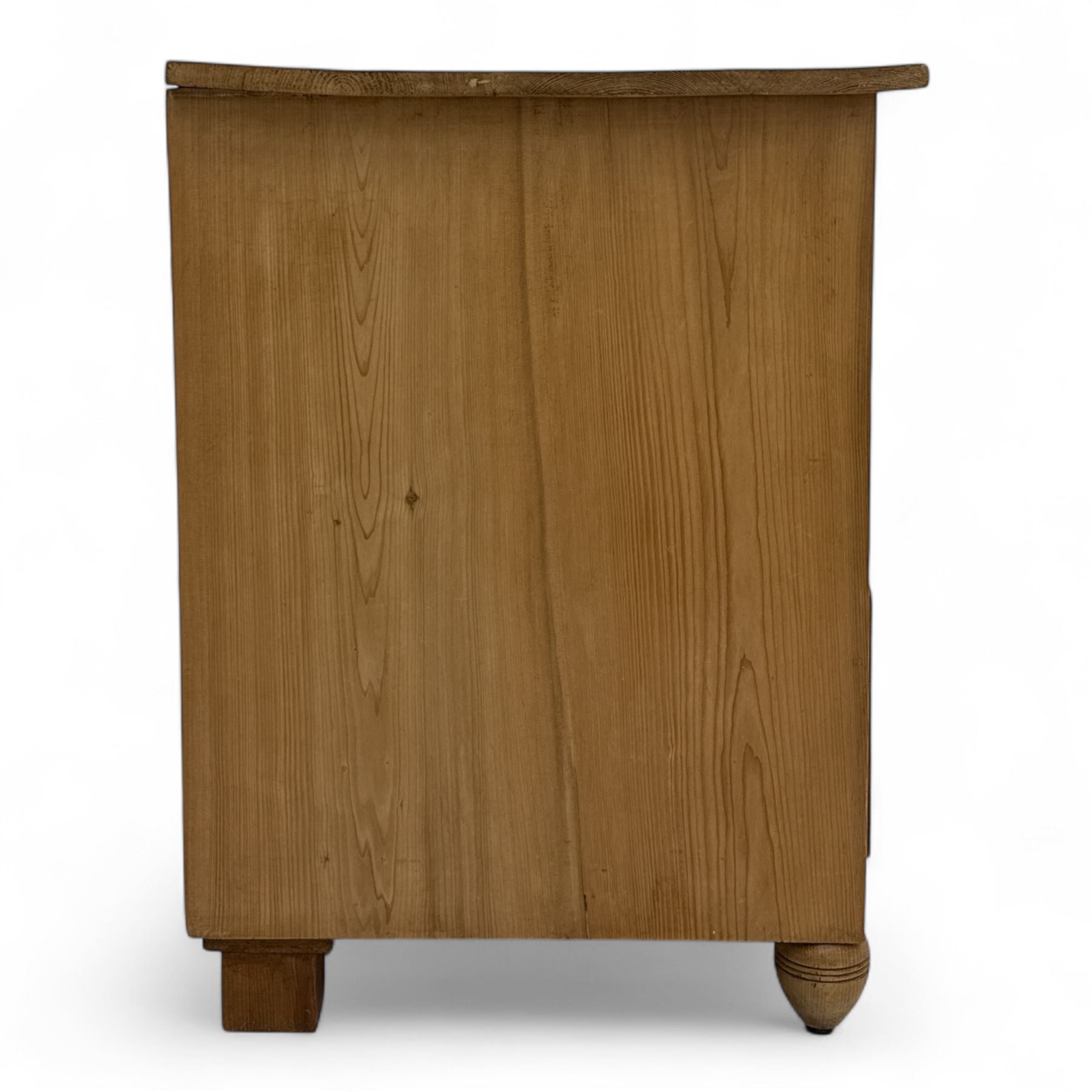 19th century pine chest of drawers, rectangular top over two short and two long drawers with oval pressed brass backplates and drop handles, panelled sides, rounded front edges, on compressed bun feet