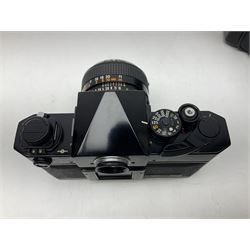 Canon F1n camera body, serial no. 572972, with 'Canon FD 50mm 1:1.4' lens, serial no. 246665, with leather case 