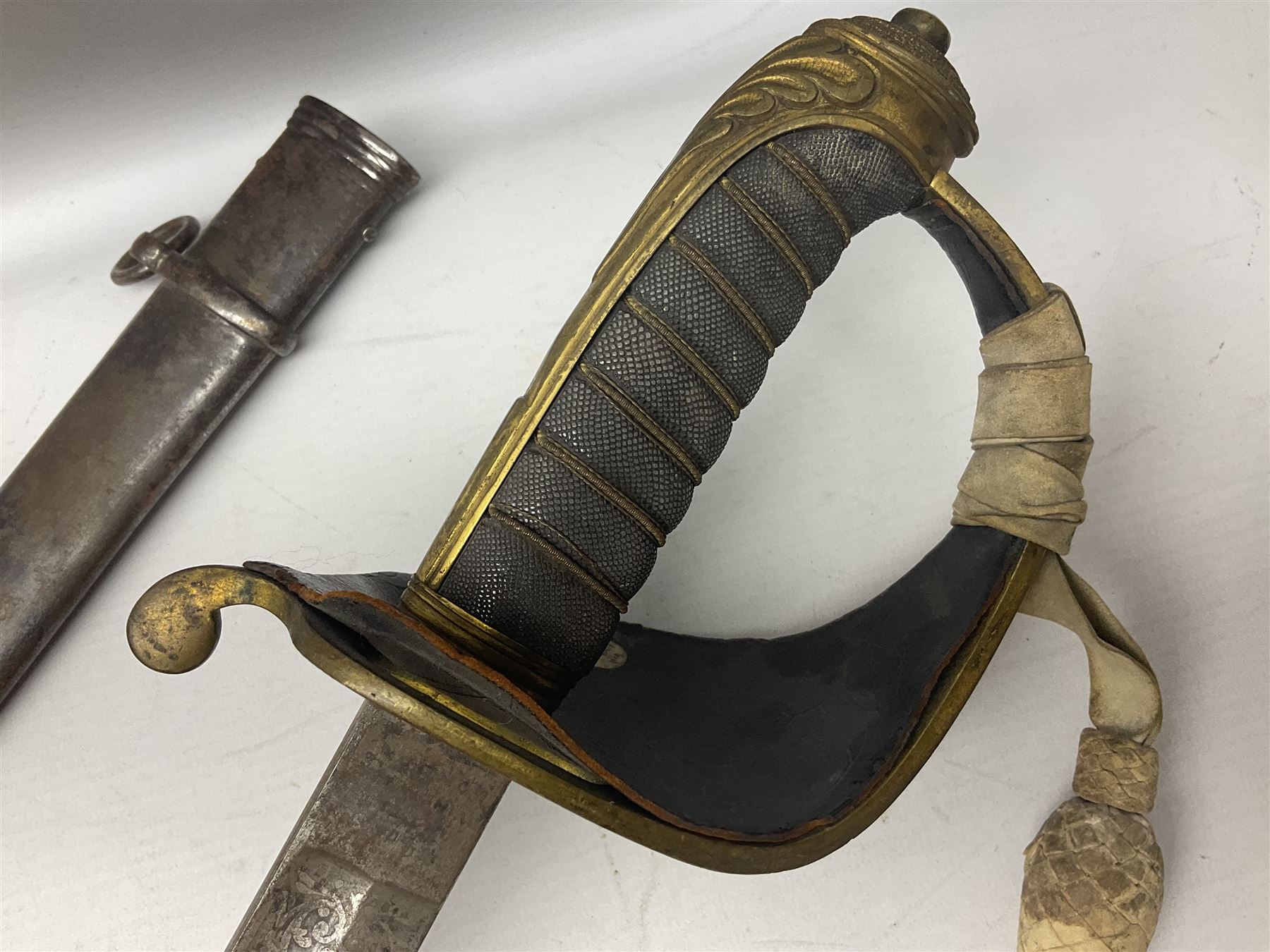 Victorian British Army officer's sword by Hobson & Sons Little Windmill Street London, the 82cm fullered steel blade etched with crowned Victoria cypher and 'HM 1st West York R.V.', lined gilded brass three-bar hilt incorporating Victoria cypher and wire-bound fish skin grip with plaited knot; in steel scabbard with two hanging rings L99cm overall