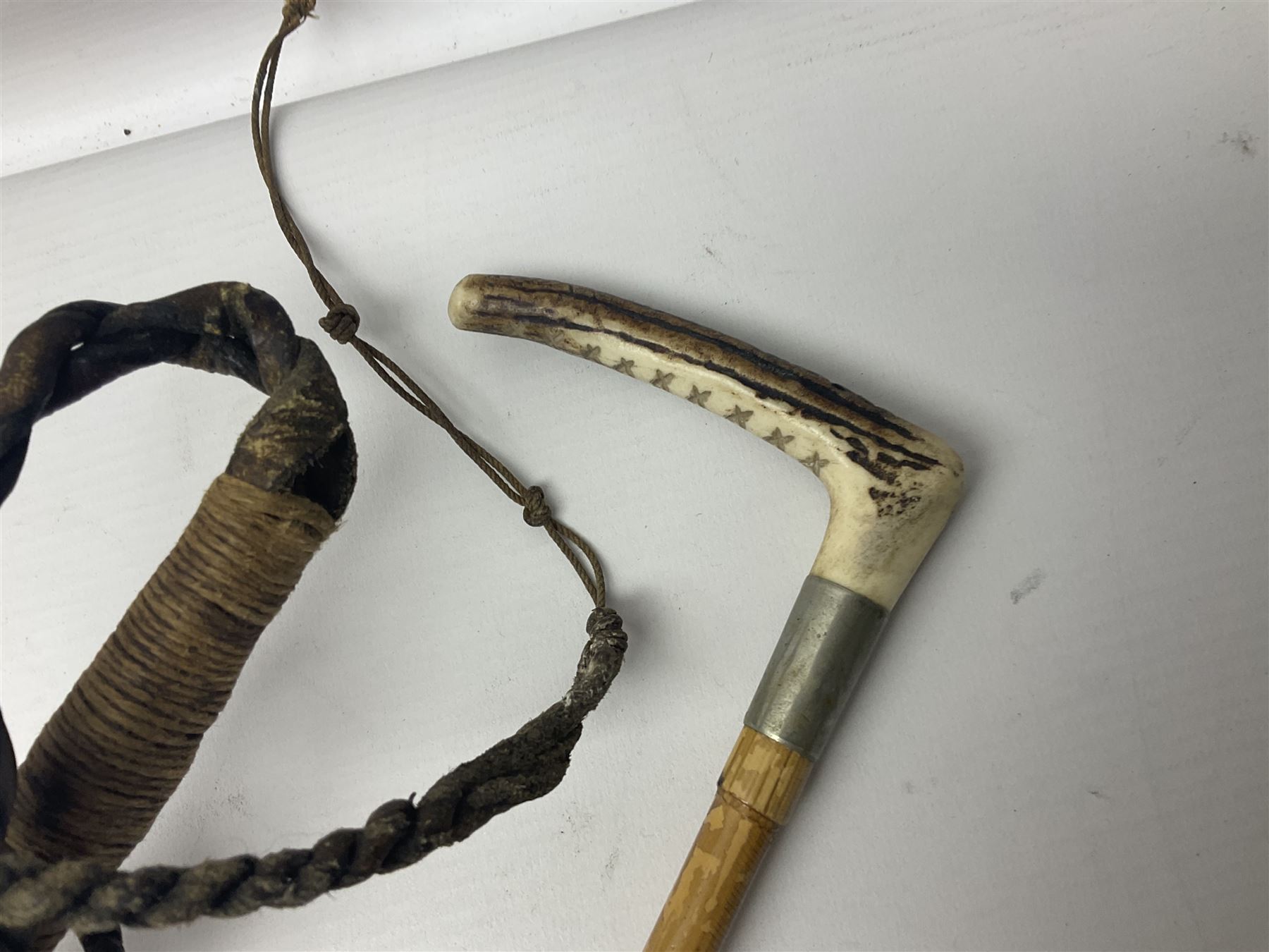 Collection of hunting crops and riding whips, including horn handle examples with silver cuffs