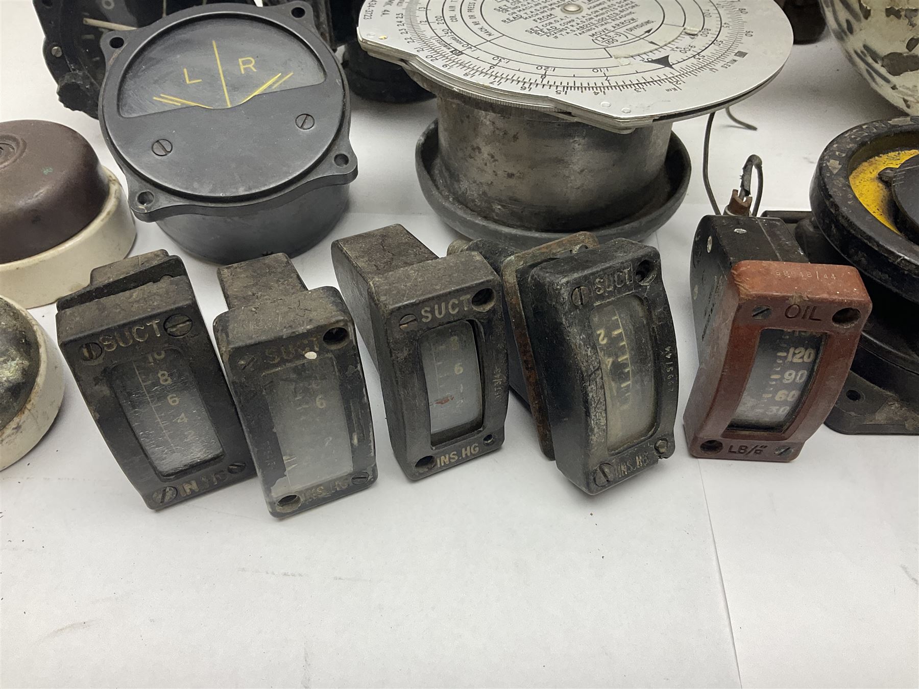 Three RAF light switches, together with military oxygen canister, batteries, gages etc  