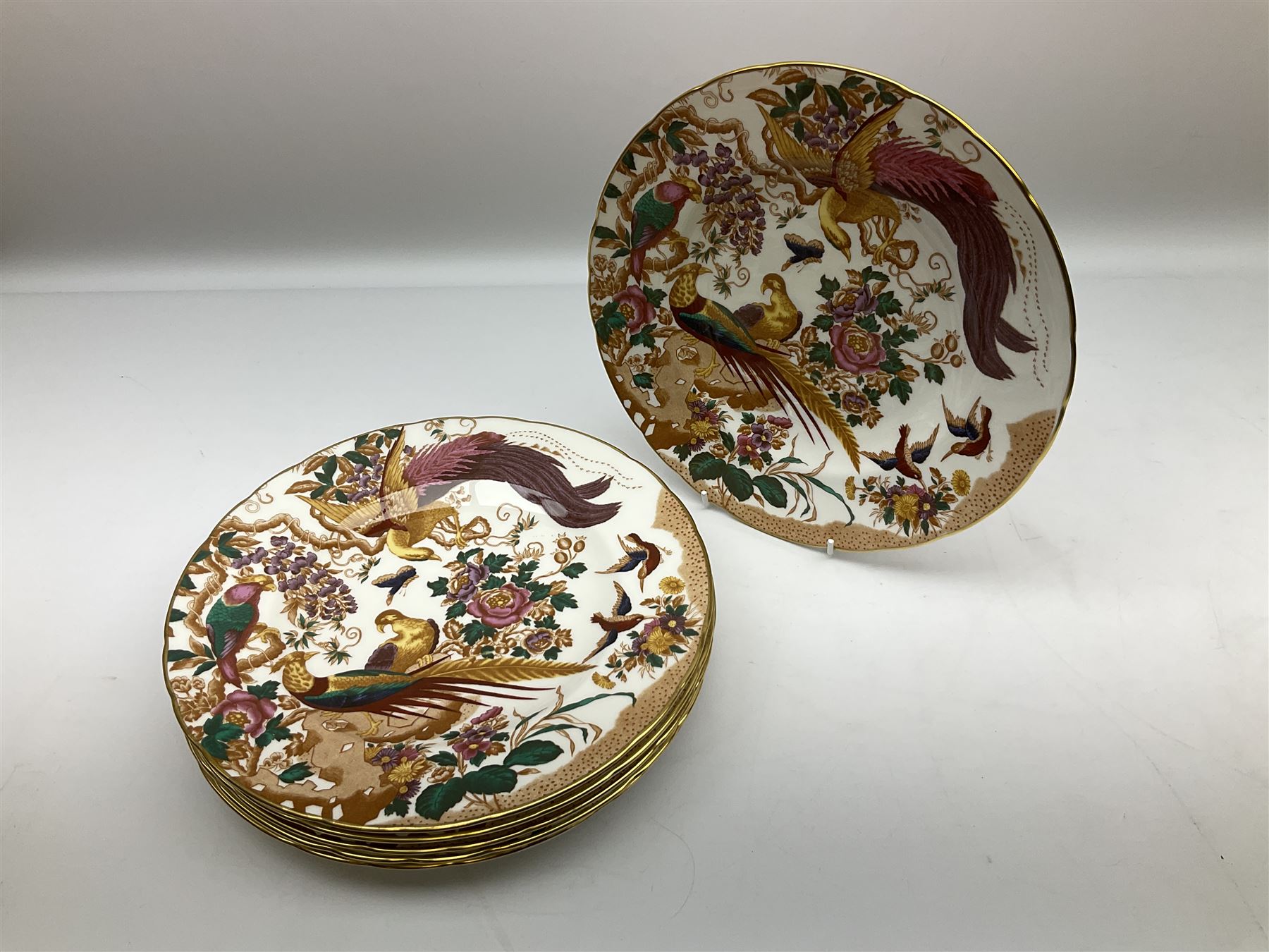 Royal Crown Derby Olde Avesbury pattern dinner and coffee service for six place settings, decorated with exotic birds amidst blossoming branches, comprising six dinner plates, six dessert plates, two tureen and covers, sauce boat and stand, oval serving platter, coffee pot, six coffee cans and six saucers, cream jug, and open sucrier, each with printed mark beneath