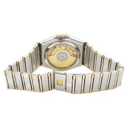 Omega Constellation gentleman's stainless steel and gold automatic chronometer wristwatch, Ref. Cal. 1111, serial No. 49547890, white dial with date aperture and exhibition back case, on integral bracelet No. 1448.5/431, with fold-over clasp