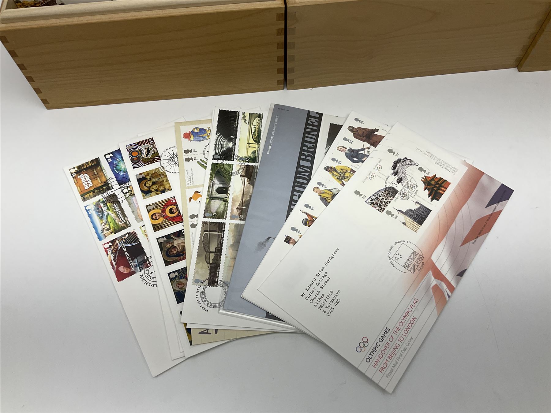 Coins and stamps, including The Royal Mint Great Britain 1970 coin set in plastic holder, 2006 'Brunel' coin cover containing two commemorative two pound coins, Alderney 2006 sterling silver proof five pounds, two 2007 five pound coins in card folders, two limited edition mint first class stamp sheets each comprised of ten first class stamps, various first day covers many with special postmarks housed in 'Royal Mail' boxes etc