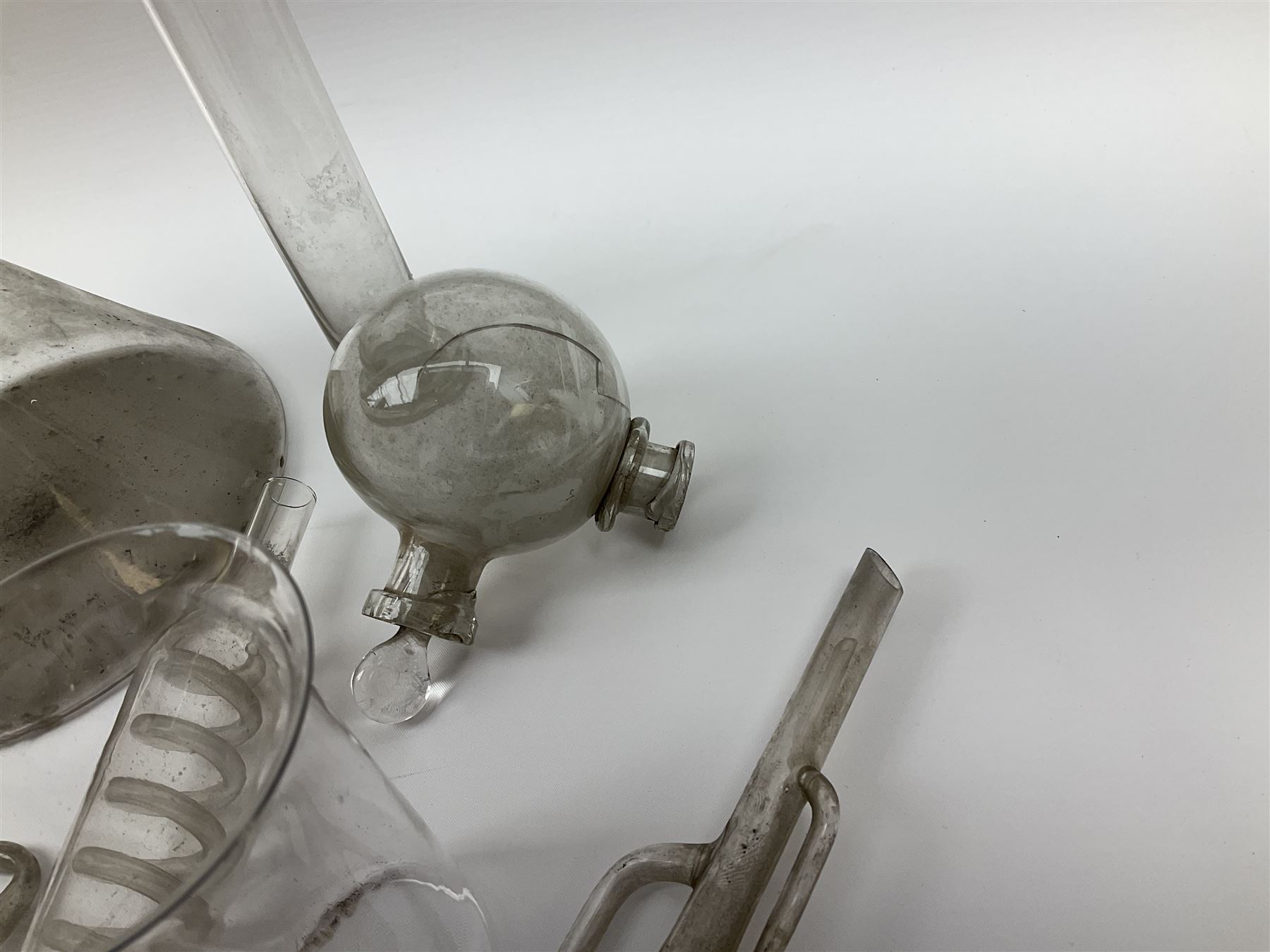 Collection of 19th century and later pharmaceutical laboratory glass, to include, volumetric flasks of various sizes, conical flask, stratus flask, etc (25) Provenance: discovered in the storeroom of a long established Hull pharmacist and opticians