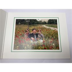 1994 Royal Christmas card with gilt embossed Prince of Wales crest to cover, the interior with colour photograph of a smiling Prince Charles, now King Charles III, Prince William and Prince Harry, amongst a field of poppies, signed in autopen 'Mr Palmer, from Charles'