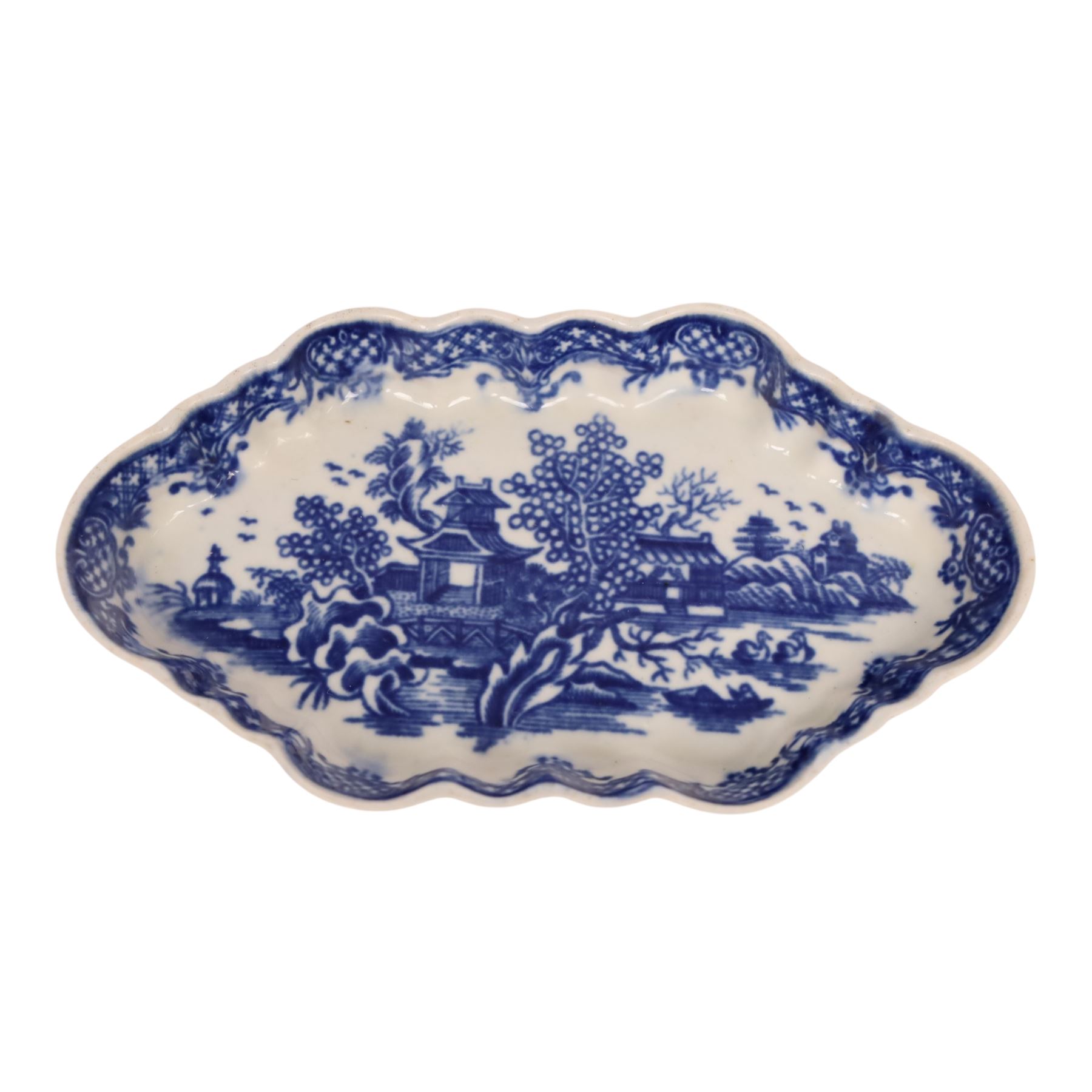 Worcester blue and white spoon tray, decorated in the Argument pattern, circa 1780-1785, L16cm, together with a Worcester blue and white bell shaped coffee cup with moulded scroll handle, decorated in the Man in the Pavilion pattern, circa 1760-1765, H6cm