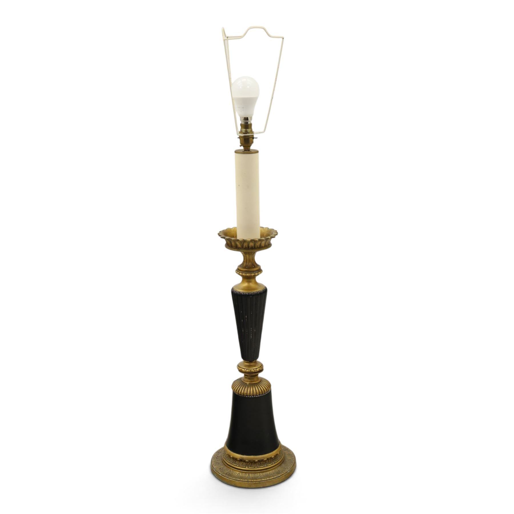 Neoclassical design table lamp, black painted and gilt metal column with fluted central section, foliate and stiff leaf cast decoration, on circular spreading base, fitted with shade frame