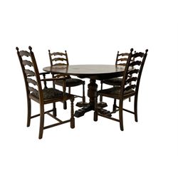 Mid-to late 20th century oak circular extending dining table, raised on turned and foliate carved baluster pedestal on quadriform base (W116cm H75cm); and set four (2+2) oak dining chairs, waived ladder back over floral patterned drop in seat, raised on turned supports (W56cm D46cm H102cm)