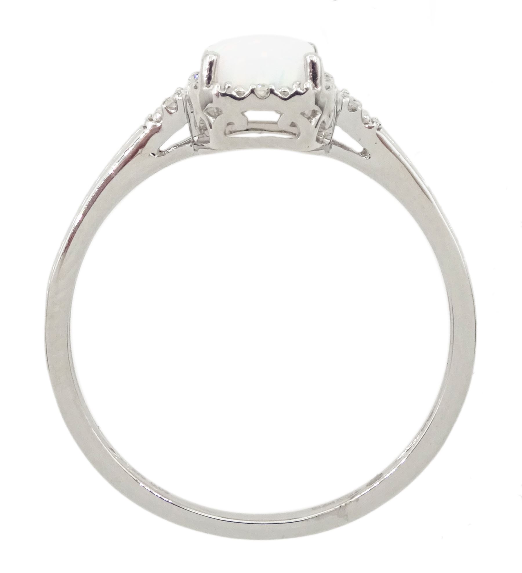 9ct white gold opal and diamond cluster ring, with diamond set shoulders, hallmarked