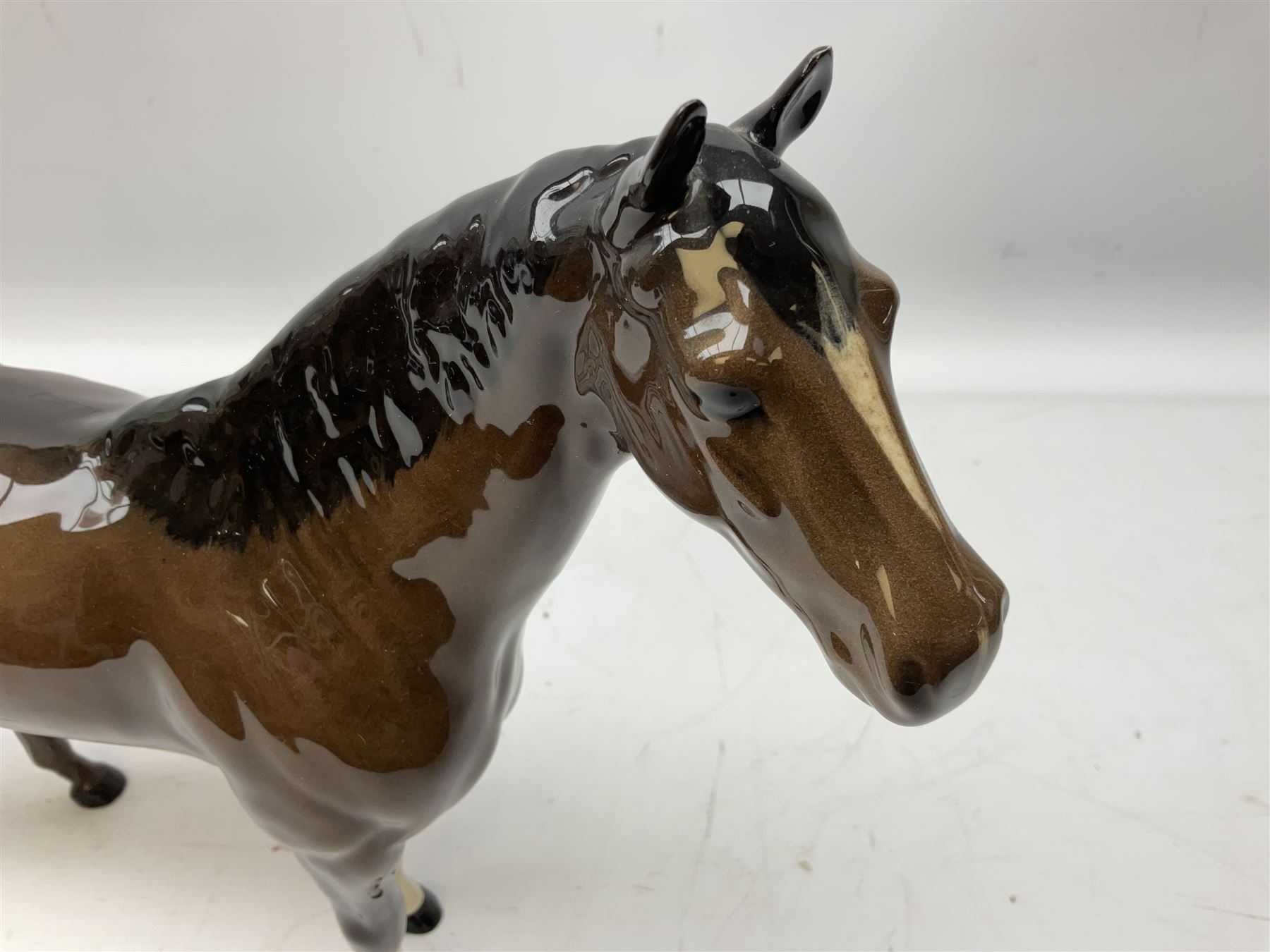 Six Beswick figures of bay horses, including large hunter no.1734, Shire horse no.818, horse with tucked head no.1549, etc (6)