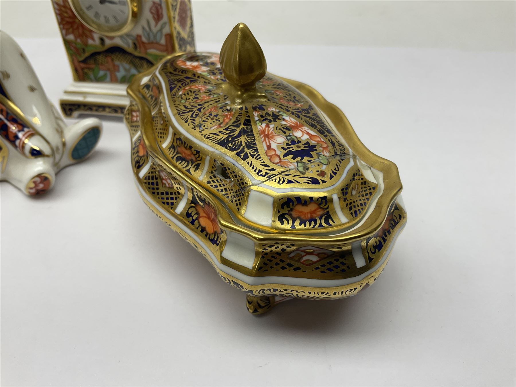 Royal Crown Derby Haiku pattern miniature clock, together with 1128 Imari pattern trinket box with cover and teddy bear figure, all with printed marks beneath   
