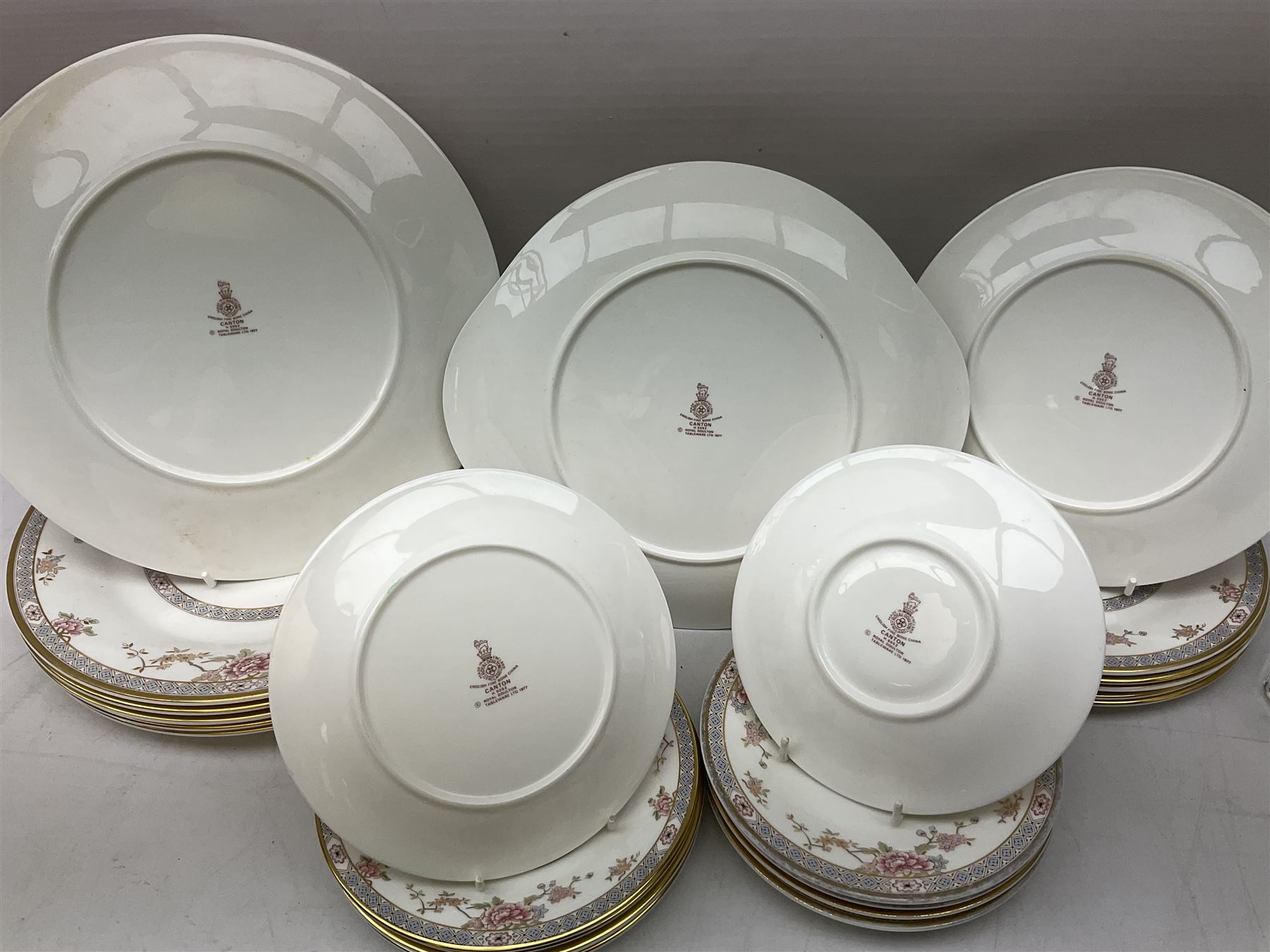 Royal Doulton Canton pattern tea and dinner wares comprising teapot, milk jug, twin handled lidded sucrier, cake plate, six dinner plates, six side plates, five smaller plates, five saucers and pair of candlestick holders, together with Sevres clear glass decanter with faceted sides and stopper, all with marks beneath