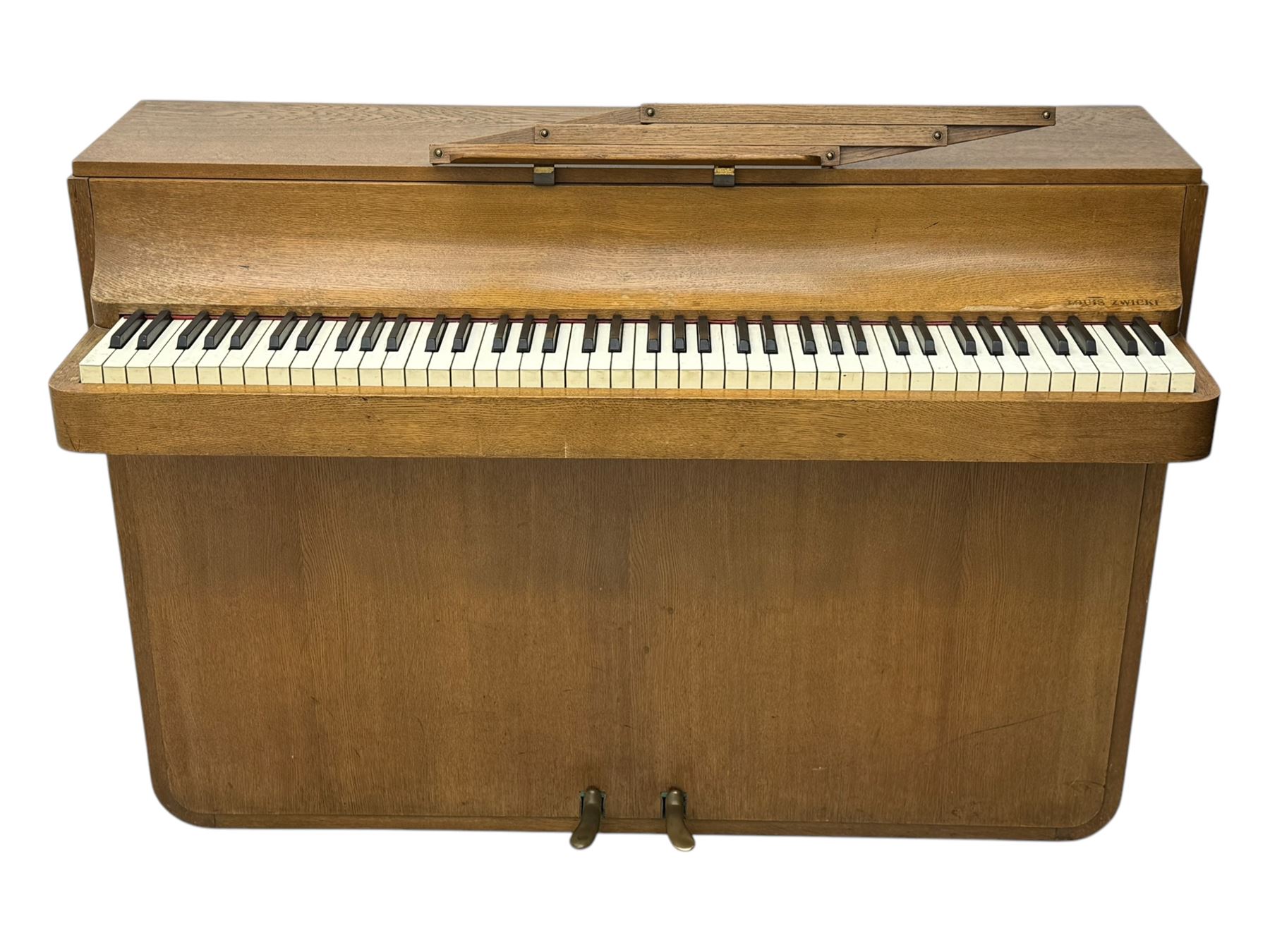 Louis Zwicki - mid-20th century oak cased compact piano, fitted with a folding music rest and full keyboard, dual brass pedals