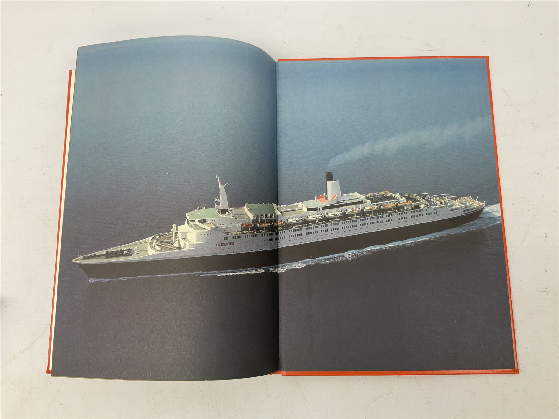 Queen Elizabeth II cradle of civilization cruise 1976 bronze medallion with related book and two other Queen Elizabeth II commemorative medallions for cruises in 1975 and 1976, all cased