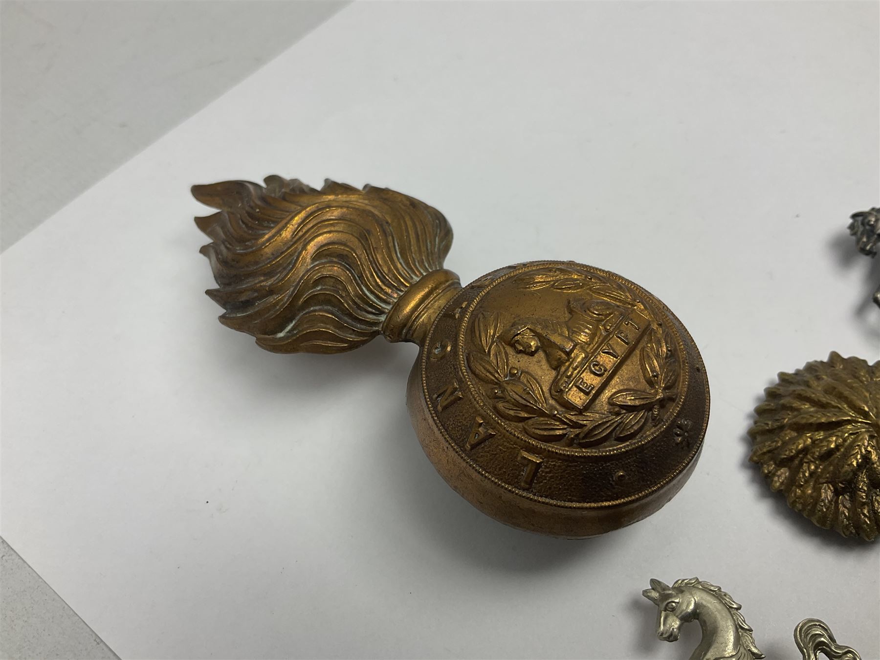 Nineteen Yeomanry metal cap badges including Derbyshire, Northamptonshire, Essex, Glamorgan, Staffordshire, City of London, Surrey, Shropshire, Hertfordshire etc; together with eleven Fusiliers badges including Lancashire, Royal Welch, Northumberland etc (30)