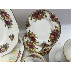 Royal albert Country Rose tea set for six, comprising teacups, saucers, dessert plates, cake plate, covered sucrier and milk jug, together with another tea set  