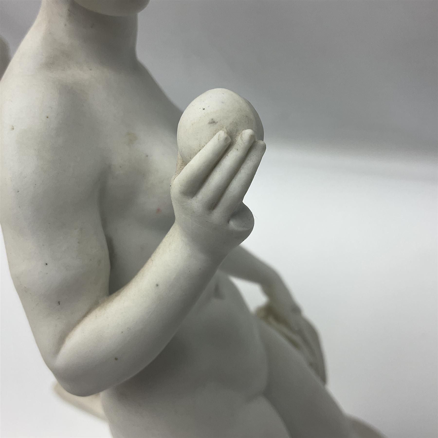 Royal Copenhagen Parian ware figure, modelled as Adonis, standing contrapposto by a tree trunk, together with a similar Parian ware figure, modelled as Venus with the Apple, both after Bertel Thorvaldsen and stamped Eneret to base with blue wave marks beneath, tallest H31.5cm