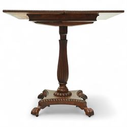 William IV mahogany folding card table of unusually small proportions, rectangular swivel top with gadrooned edge, raised on a slender tapered reeded column over quatreform base with gadrooned border, terminating in carved lion paws feet